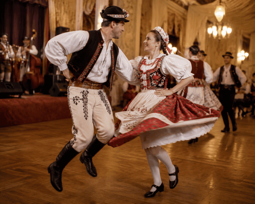 Couple performing the polka dance in a traditional Central European ballroom