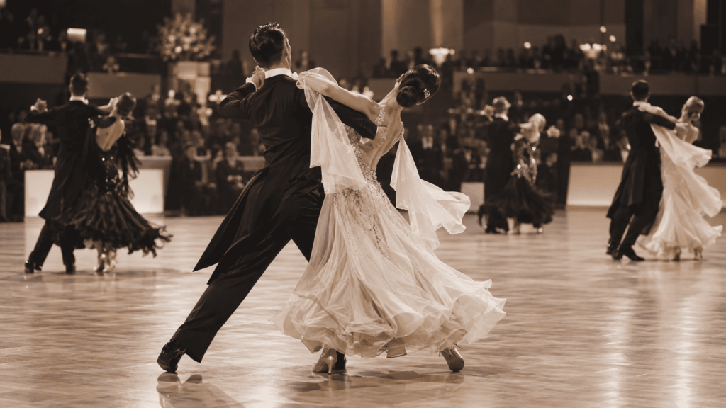 Ballroom couples performing during a formal modern dance competition